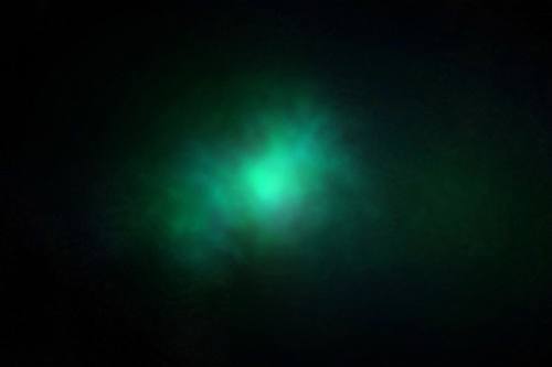 Deep dark gradient with a single glowing emerald light bloom, moody minimal abstract background, subtle grain
