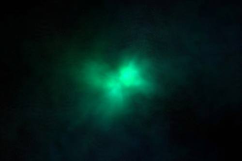 Deep dark gradient with a single glowing emerald light bloom, moody minimal abstract background, subtle grain