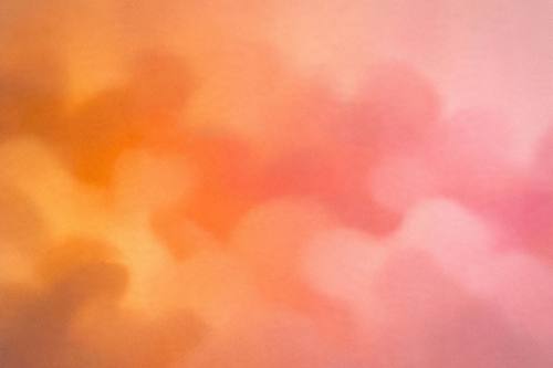 Abstract soft blurred blobs of warm sunset colors, orange to pink, subtle noise, calm gradient wallpaper